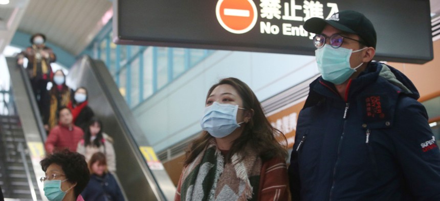 People wear masks at a metro station in Taipei, Taiwan on Tuesday.