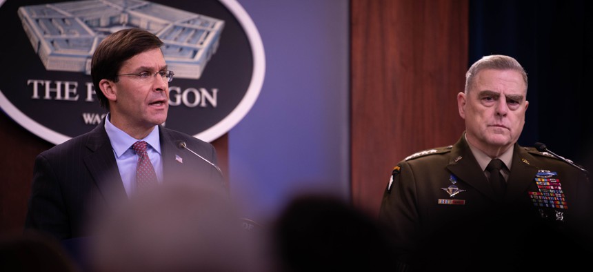 Defense Secretary Mark T. Esper and Chairman of the Joint Chiefs of Staff Army Gen. Mark A. Milley briefs the media at the Pentagon in December.