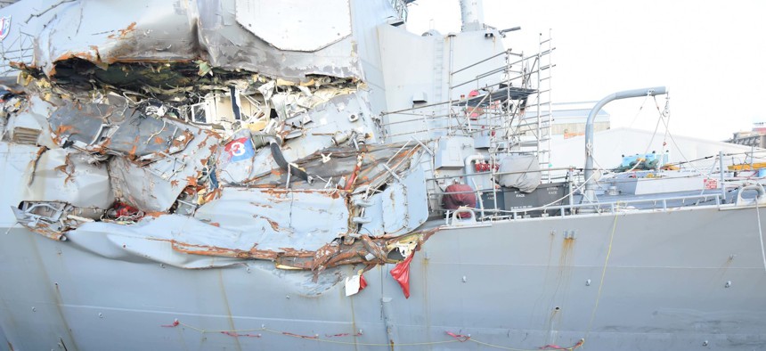 The Arleigh Burke-class guided-missile destroyer USS Fitzgerald (DDG 62) sits in Dry Dock 4 at Fleet Activities (FLEACT) Yokosuka to continue repairs and assess damage sustained from its June 17 collision with a merchant vessel.