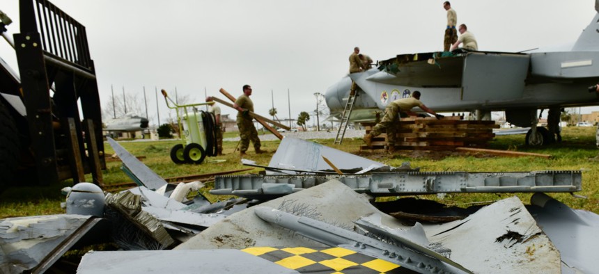  Airmen from the 325th Maintenance Squadron prepare to disassemble and transport a McDonnell Douglas F-15 Eagle that was damaged after Hurricane Michael at Tyndall Air Force Base in 2019.