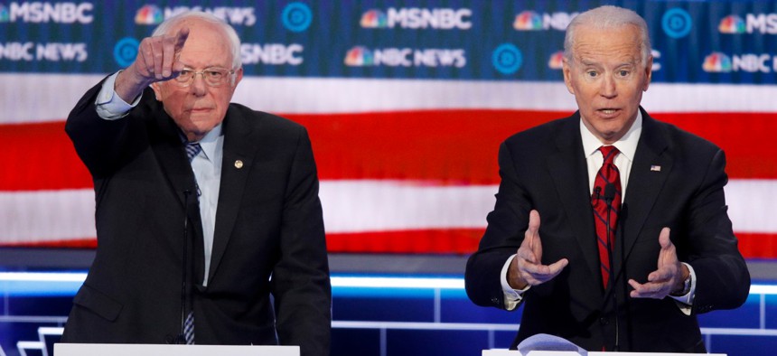 Sen. Bernie Sanders, I-Vt., left, during Wednesday's presidential primary debate defended his failure to fully release his medical records. Former Vice President Joe Biden, right,  said transparency is important but has also faced questions on the issue.