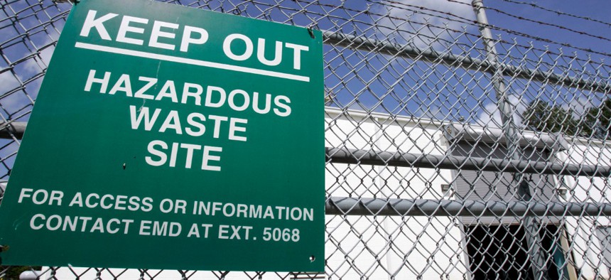 A sign is posted at an ongoing cleanup pump and treatment center operated by Shaw Corp. on lot 203 at Camp Lejeune, N.C., in 2007.