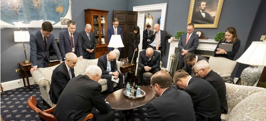 Vice President Mike Pence prays with the President’s Coronavirus Taskforce on Wednesday, February 26.