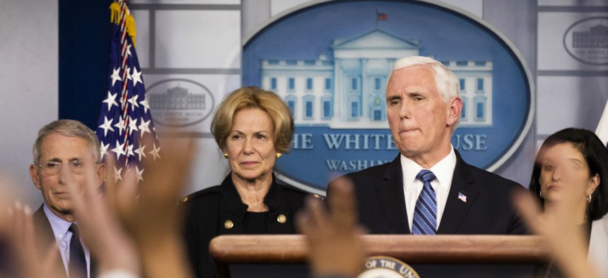Vice President Mike Pence, with White House coronavirus response coordinator Dr. Deborah Birx and other members of the president's task force on coronavirus take questions at the White House March 2. 
