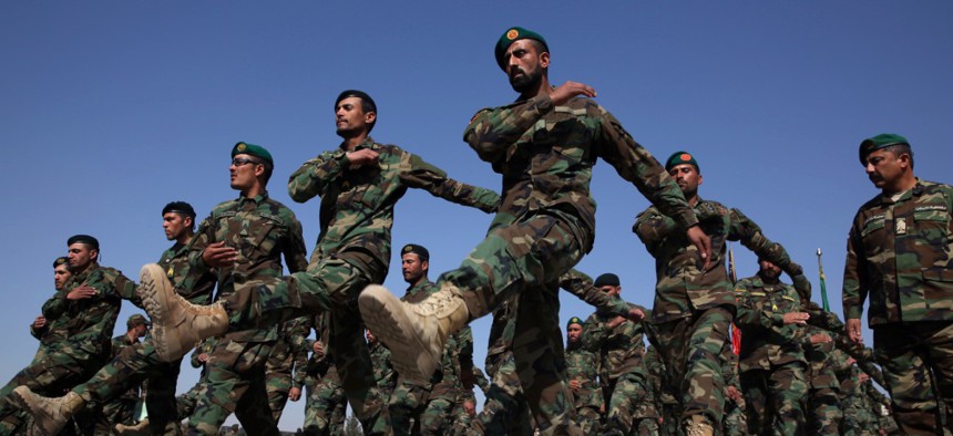 New Afghan National Army recruits march during their February graduation ceremony.