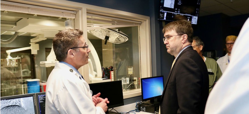 VA Secretary Robert Wilkie, above right, tours the Minneapolis VA Health Care System in August 2018.