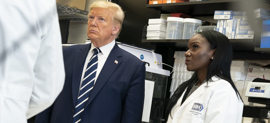President Donald J. Trump tours the viral pathogenesis laboratory Tuesday, March 3, 2020, at the National Institutes of Health in Bethesda, Md. 