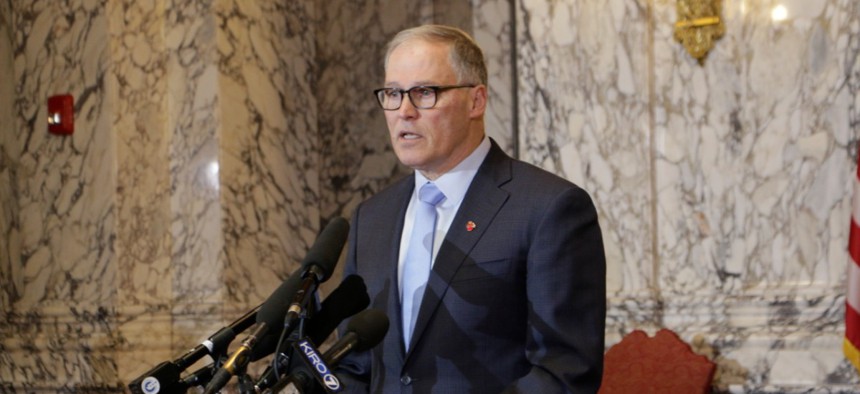 Washington Gov. Jay Inslee talks to the media about his decision to expand school closures and prohibition of large gatherings across all of Washington State on Friday.