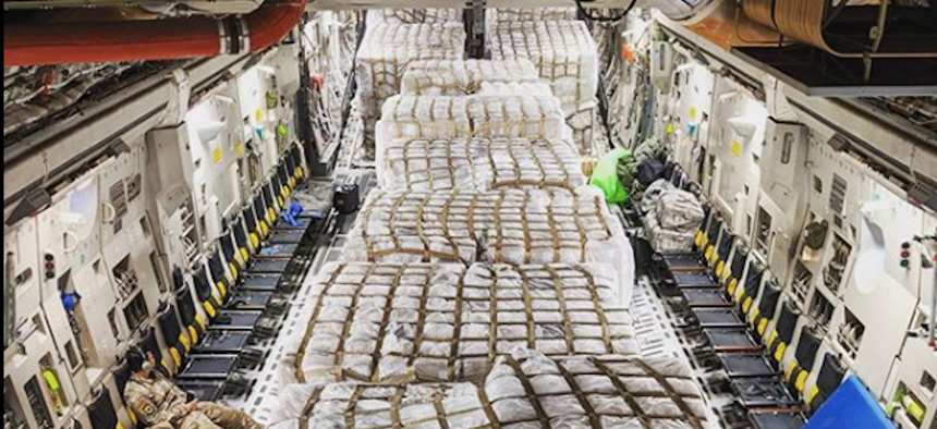 This photo was posted with the caption: "Got to be part of something special last night. These pallets right here are 500,000 covid-19 testing kits that the aircrew I was a part of…” The post has since been taken down.