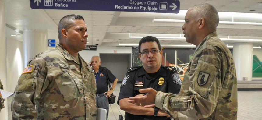 Puerto Rico National Guard and local law enforcement helped establish the action plan to be taken with passengers arriving at Luis Muñoz Marín International Airport in Carolina, Puerto Rico, to detect any suspected cases of COVID-19, March 16.