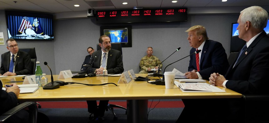 President Trump, second from right, speaks during a teleconference with governors at the Federal Emergency Management Agency headquarters, Thursday, March 19.