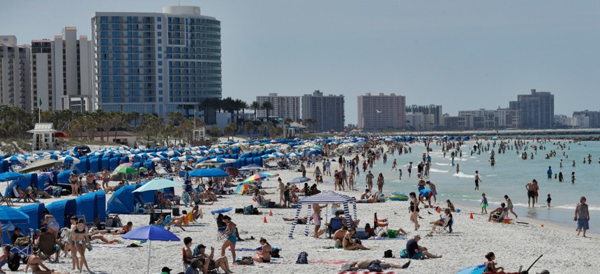 Visitors gather at Florida's Clearwater Beach on March 18.