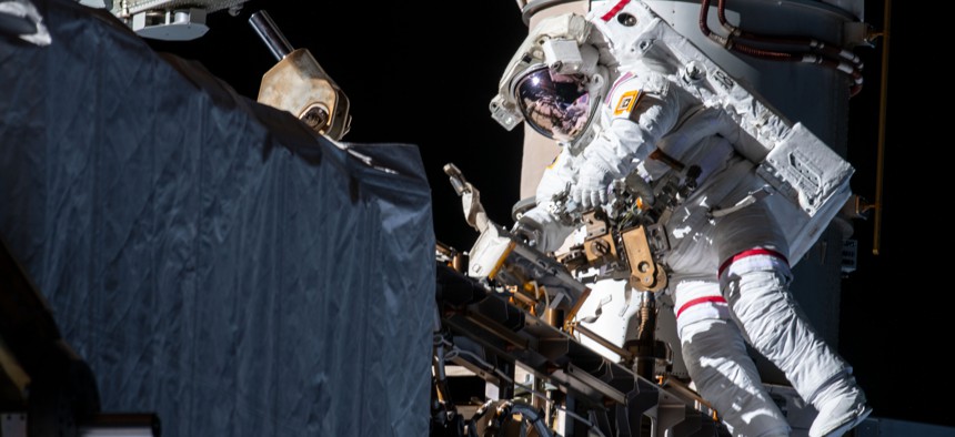 NASA astronaut Andrew Morgan works while tethered on the Port 6 truss segment of the International Space Station to replace older hydrogen-nickel batteries with newer, more powerful lithium-ion batteries in 2019.