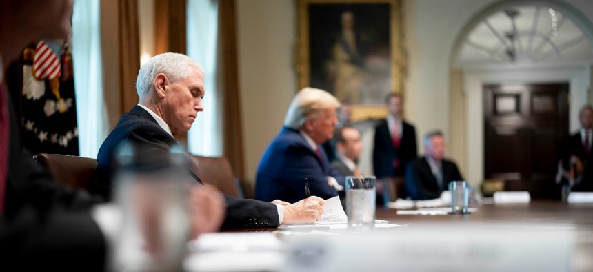 President Trump and Vice President Pence meet with supply chain distributers in response to the coronavirus pandemic on March 29 in the Cabinet Room of the White House.