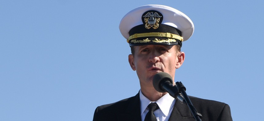 Capt. Brett Crozier addresses the crew for the first time as commanding officer of the aircraft carrier USS Theodore Roosevelt during a change of command ceremony on the ship’s flight deck in November 2019. 