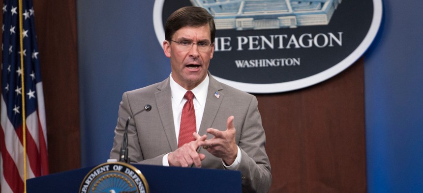 Defense Secretary Mark Esper delivers a coronavirus briefing in March. 
