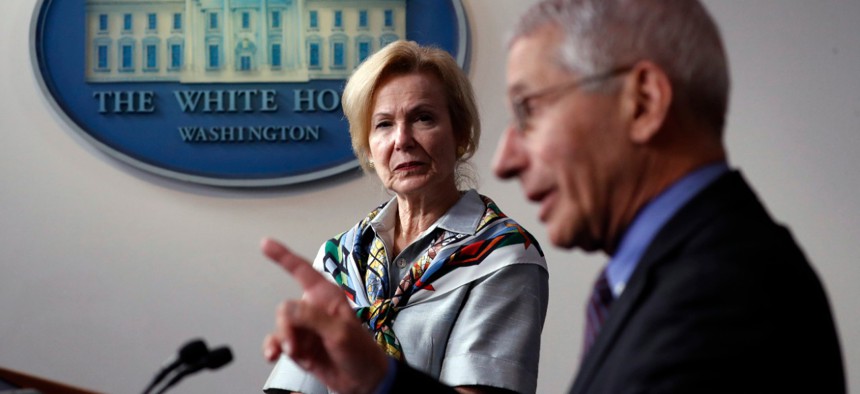 Dr. Anthony Fauci, director of the National Institute of Allergy and Infectious Diseases, speaks about the novel coronavirus Thursday as Dr. Deborah Birx, White House coronavirus response coordinator, listens.