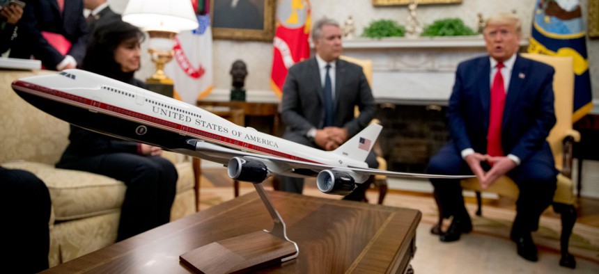 A model of the new Air Force One design sits on a table as President Trump meets with Colombian President Ivan Duque, second from right, in the Oval Office on March 2.