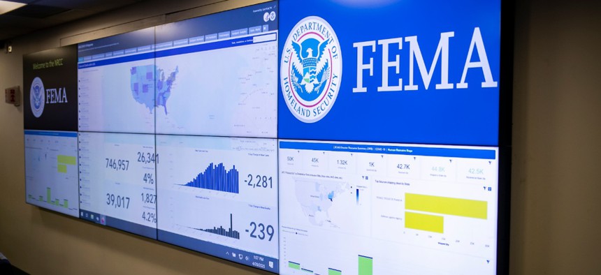 A screen shows information about the novel coronavirus at the Federal Emergency Management Agency headquarters on Monday. 