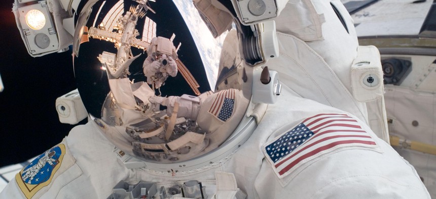  STS-124 Mission Specialist Mike Fossum participates in the mission's first spacewalk in 2008.