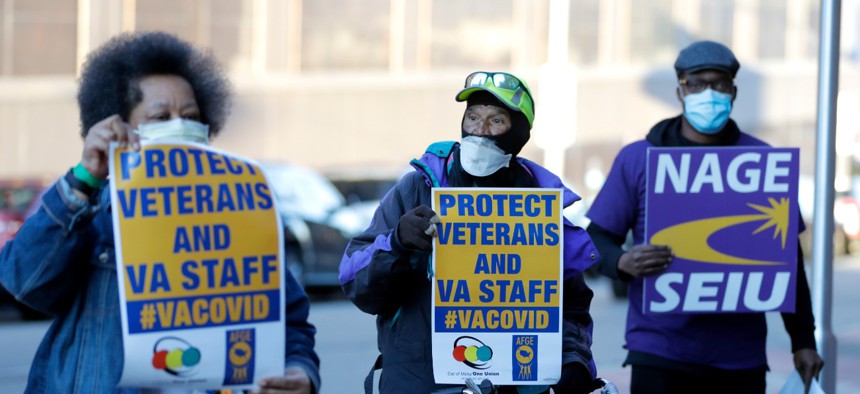A small group of activists from the American Federation of Government Employees local 424 and the National Association of Government Employees local R3-19 outside the Baltimore VA Medical Center April 22.