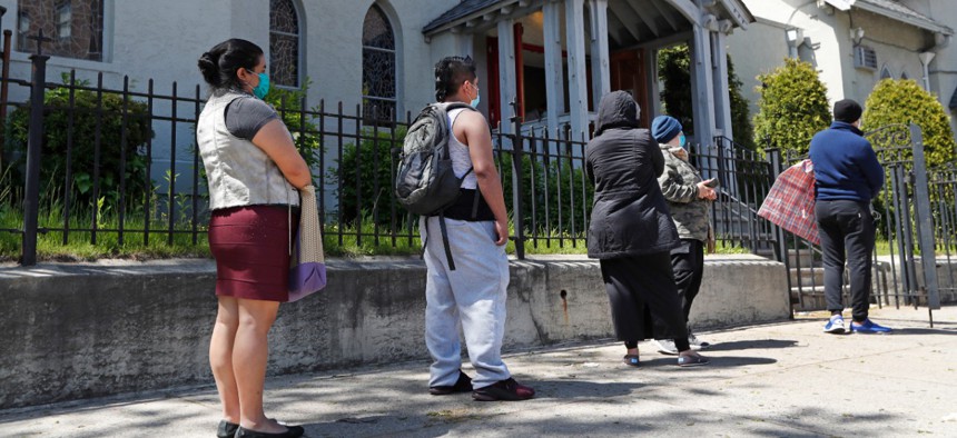 People form a line while waiting to pick up donated groceries from the Brooklyn Immigrant Community Support mutual aid program at Lutheran Church of the Good Shepherd in the Bay Ridge neighborhood of Brooklyn on May 12.