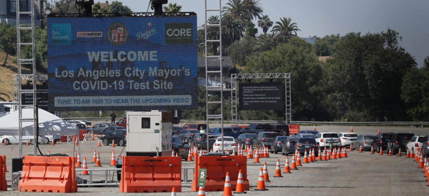 Motorists line up at a coronavirus testing site set up at Dodger Stadium on May 26 in Los Angeles.