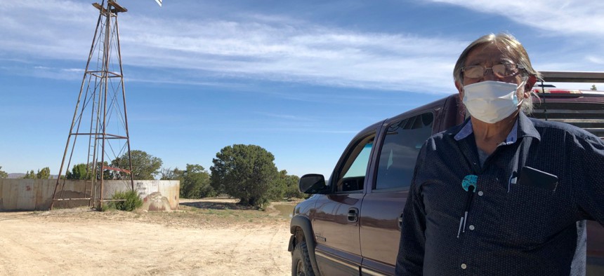 Johnnie Henry, president of the Navajo Nation’s Church Rock chapter house community center, hauls drinking water to neighbors in Gallup, N.M., May 7, 2020