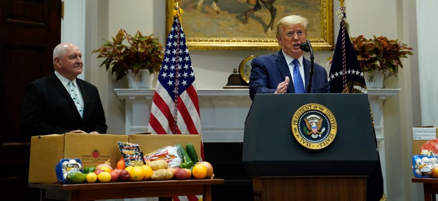 Agriculture Secretary Sonny Perdue and President Donald Trump at a May 19 event to promote a new food aid program