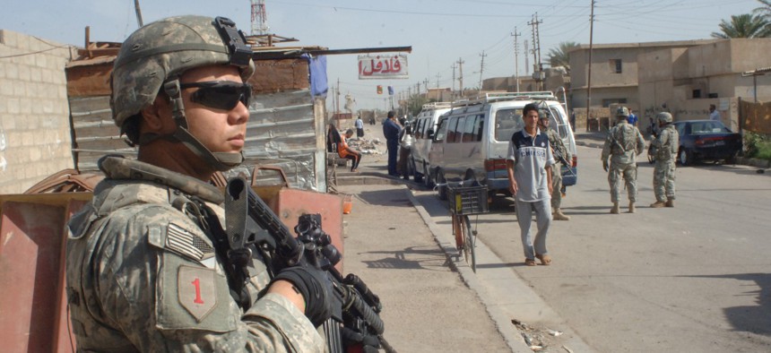 Pvt. Anthony Salazar, Bravo Company, 1st Battalion, 28th Infantry Regiment, 4th Brigade Combat Team, 1st Infantry Division pulls security during a patrol in the Furat area of Baghdad, Iraq on May 8, 2007.