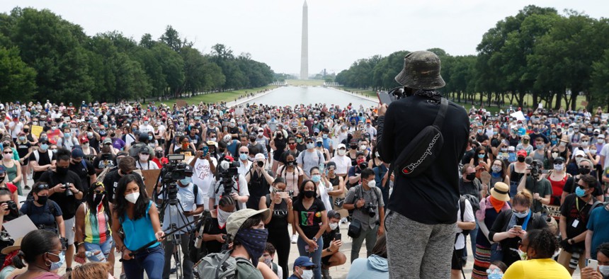 Demonstrators protest Saturday, June 6, 2020, at the Lincoln Memorial in Washington.