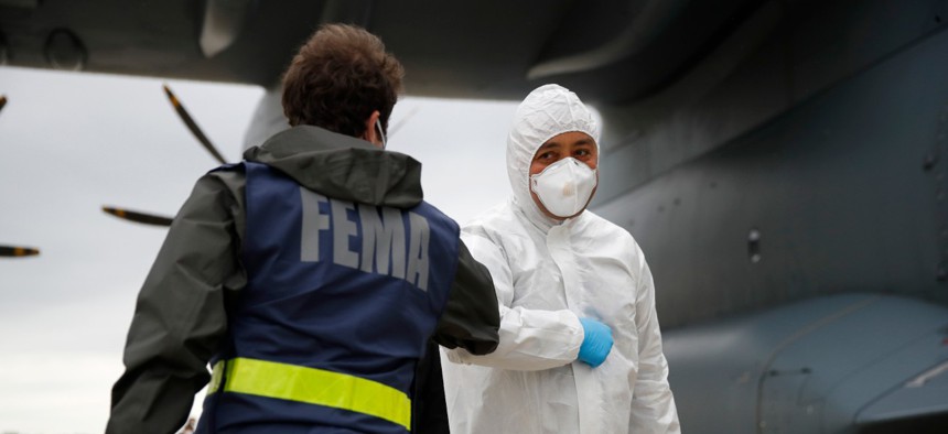 A FEMA official unloads medical supplies arriving from Turkey at Andrews Air Force Base in Maryland in late April.