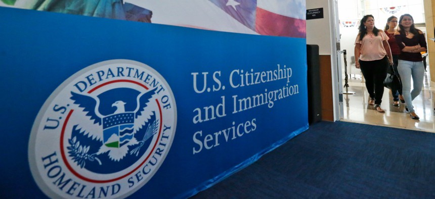 People arrive before the start of a naturalization ceremony at the U.S. Citizenship and Immigration Services Miami Field Office in 2008.
