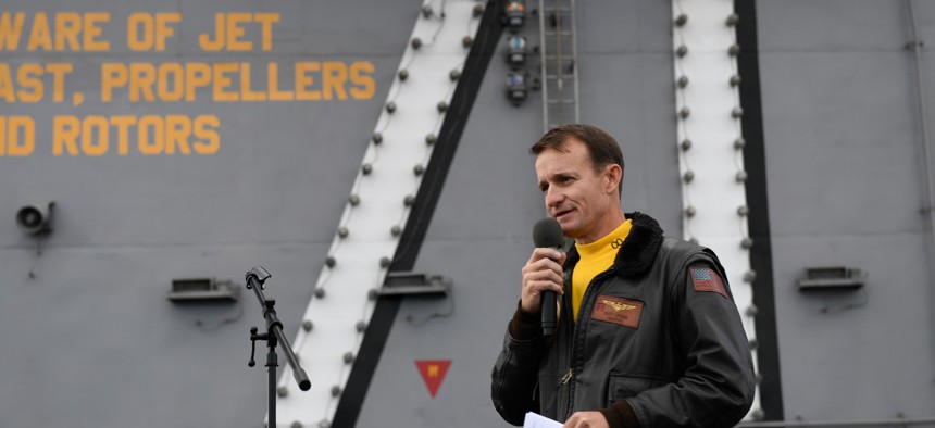 Capt. Brett Crozier, commanding officer of the aircraft carrier USS Theodore Roosevelt (CVN 71), addresses the crew during an all-hands call on the ship’s flight deck in November 2019. 
