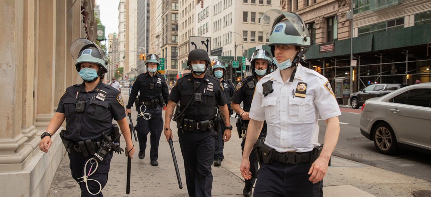 New York City police officers are seen in Lower Manhattan during a demonstration in early June.