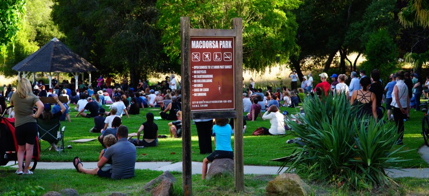 People gather in a park in California in June.