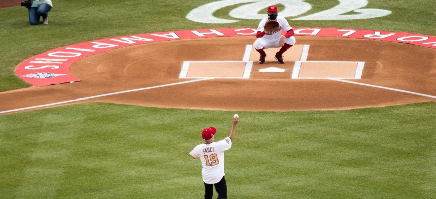 Director of the National Institute of Allergy and Infectious Diseases Dr. Anthony Fauci throws out the ceremonial first pitch at Nationals Park before the New York Yankees and the Washington Nationals play an opening day baseball game Thursday.