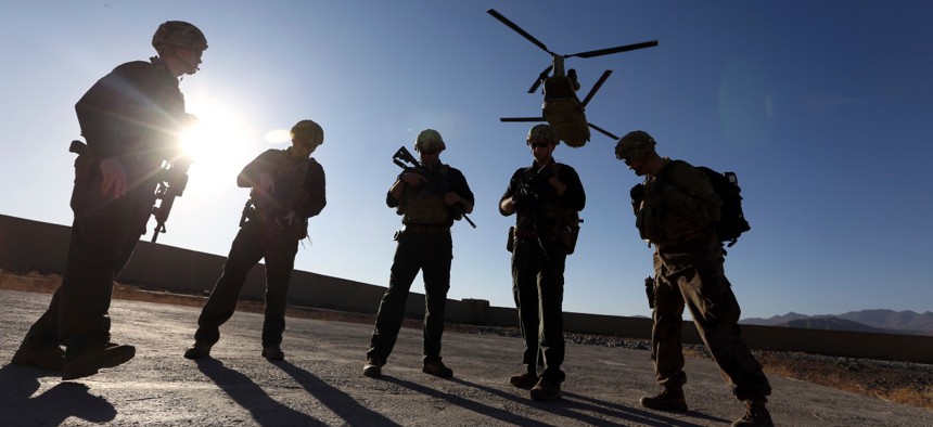 American soldiers wait on the tarmac in Logar province, Afghanistan, in November 2017. 
