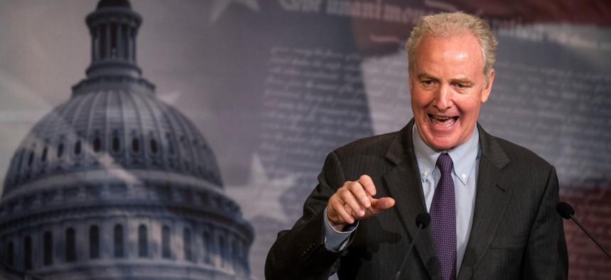 Sen. Chris Van Hollen, D-Md., speaks during a news conference on Capitol Hill in June. Van Hollen is one of the senators advocating extra protections for feds. 