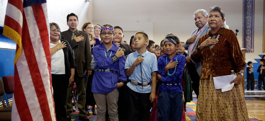 Students and teachers recite the Pledge of Allegiance at Crystal Boarding School in Crystal, New Mexico, on the Navajo Nation in 2014. The school is overseen by the BIE. 
