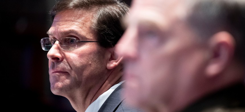 Defense Secretary Mark Esper, left, and Chairman of the Joint Chiefs of Staff Gen. Mark Milley listen during a House Armed Services Committee hearing on July 9. 