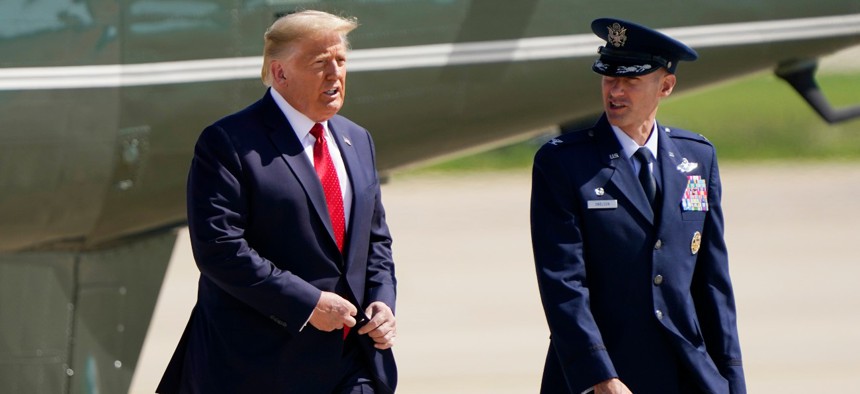 President Trump arrives to board Air Force One at Andrews Air Force Base in Maryland on Monday. Trump will spend the day campaigning in Minnesota and Wisconsin. 