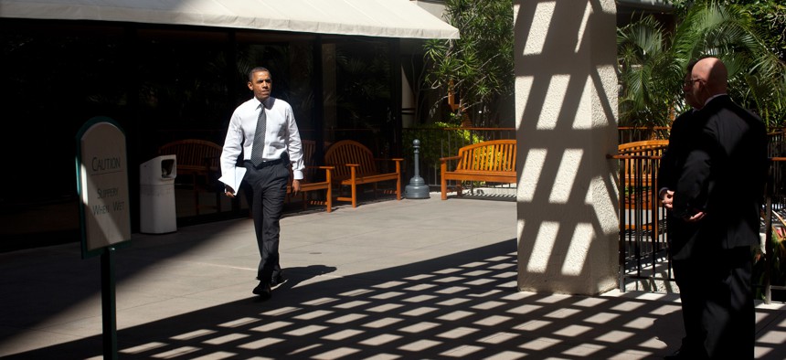 Barack Obama walks to a meeting during the APEC summit in Honolulu in 2011.
