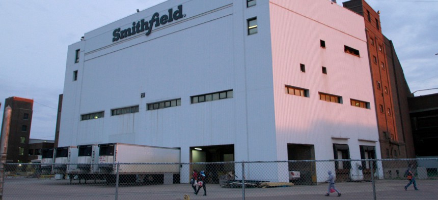 Employees of two departments at the Smithfield pork processing plant in Sioux Falls, S.D. report to work in May as the plant moved to reopen after a coronavirus outbreak infected workers. 