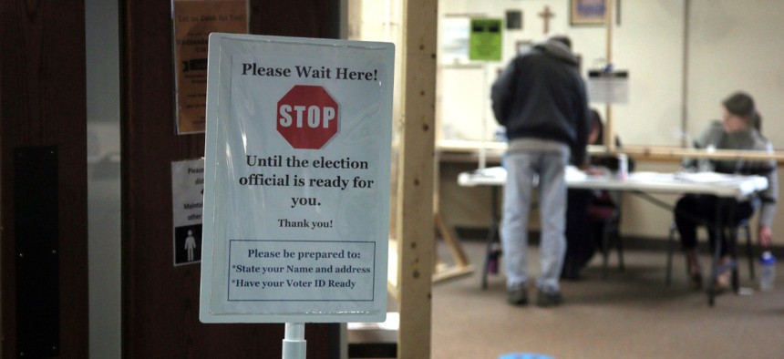 A sign alert voters at the United Methodist Church polling place Tuesday, May 12, 2020, in Hudson, Wis.in Wisconsin's special congressional election to replace retired Republican reality TV star Sean Duffy, in the 7th District race.