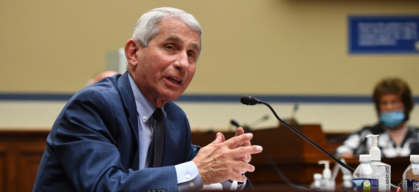 Dr. Anthony Fauci, director of the National Institute of Allergy and Infectious Diseases, speaks during a July 31 congressional hearing. Fauci was in surgery on Aug. 20 when the coronavirus task force discussed a change in guidance. 