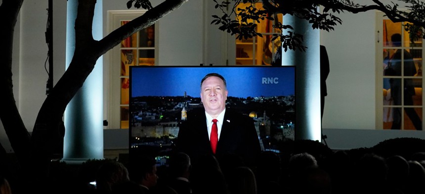 A video of Secretary of State Mike Pompeo speaking during the Republican National Convention plays from the Rose Garden of the White House on Aug. 25.
