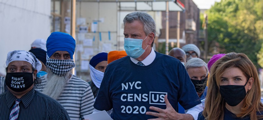 New York City Mayor Bill de Blasio and NYC Census 2020 Director Julie Menin go door-knocking to encourage New Yorkers to complete the census in South Richmond Hill, Queens, on July 29.