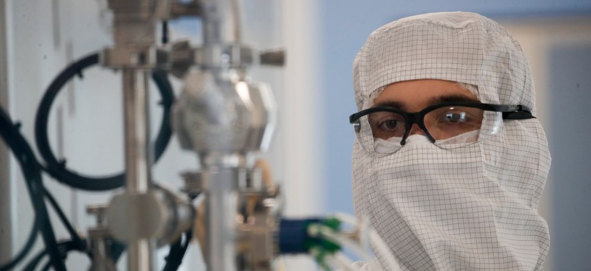 A laboratory technician works at the mAbxience biopharmaceutical company in Garin, Argentina, Friday, Aug. 14, 2020. Under an agreement between Argentina and Mexico announced this week, the company is going to make an AstraZenneca-Oxford COVID19 vaccine