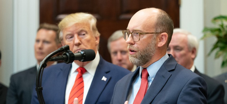 OMB Director Russell Vought, right, claimed that federal agencies make employees attend training sessions that teach critical race theory, an academic framework which studies how racism persists institutionally rather than as personal animus. 